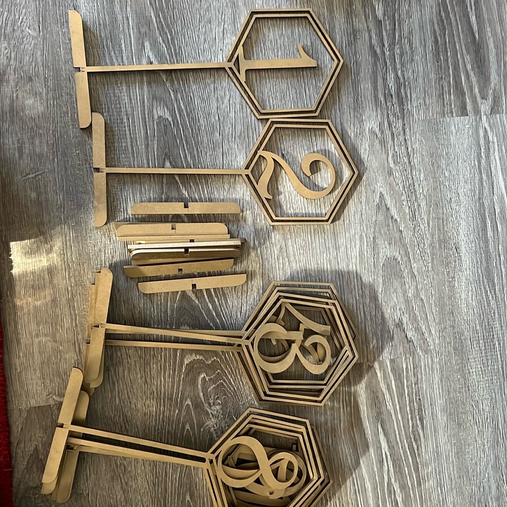 11 antique gold table number stands, 12-16 brighter gold stands
